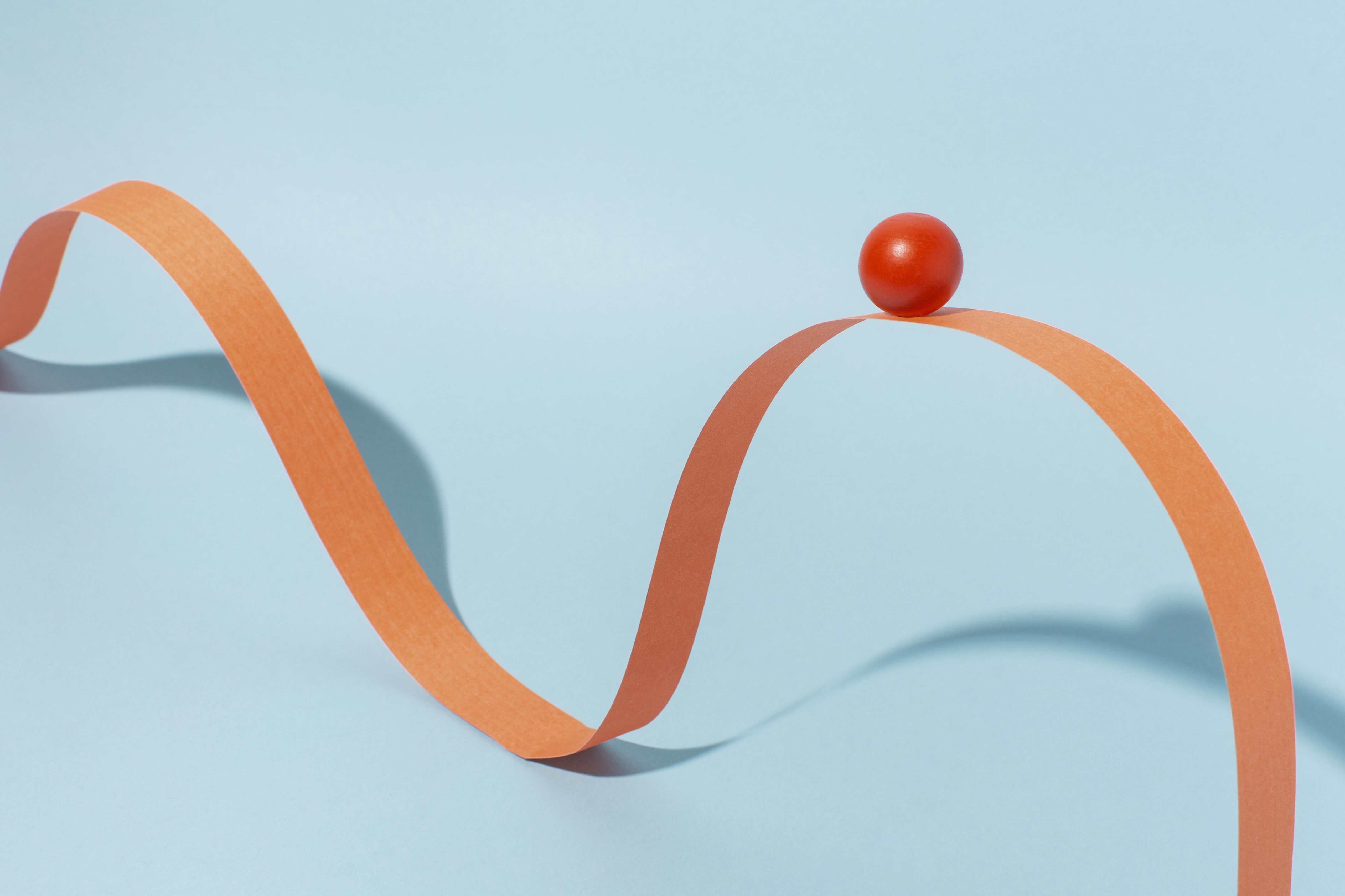 orange ribbon with ball